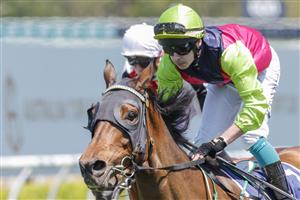 SYDNEY, AUSTRALIA - OCTOBER 15: Robbie Dolan (lime cap) on Cisco Bay wins race 2 the Big Dance Wild Card during Everest Day at Royal Randwick Racecourse on October 15, 2022 in Sydney, Australia. (Photo by Jenny Evans/Getty Images)