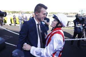 SYDNEY, AUSTRALIA - OCTOBER 15: Trainer Clayton Douglas and Craig Williams hug after winning The Everest with Giga Kick during Everest Day at Royal Randwick Racecourse on October 15, 2022 in Sydney, Australia. (Photo by Mark Evans/Getty Images)