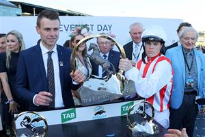Trainer Clayton Douglas (L) and jockey Craig Williams of Giga Kick lift the Everest 2022 horse race trophy at the Royal Randwick race course in Sydney on October 15, 2022. - XGTY-- IMAGE RESTRICTED TO EDITORIAL USE - STRICTLY NO COMMERCIAL USE -- (Photo by DAVID GRAY / AFP) / XGTY-- IMAGE RESTRICTED TO EDITORIAL USE - STRICTLY NO COMMERCIAL USE -- (Photo by DAVID GRAY/AFP via Getty Images)