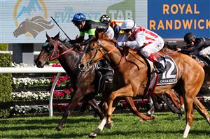 Giga Kick (R), ridden by jockey Craig Williams, wins the Everest 2022 horse race at the Royal Randwick race course in Sydney on October 15, 2022. - XGTY-- IMAGE RESTRICTED TO EDITORIAL USE - STRICTLY NO COMMERCIAL USE -- (Photo by DAVID GRAY / AFP) / XGTY-- IMAGE RESTRICTED TO EDITORIAL USE - STRICTLY NO COMMERCIAL USE -- (Photo by DAVID GRAY/AFP via Getty Images)