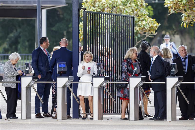 SYDNEY, AUSTRALIA - OCTOBER 22: Racegoers line up to get the best spots before the gates open ahead of Spring Champions Stakes Day at Royal Randwick Racecourse on October 22, 2022 in Sydney, Australia. (Photo by Jenny Evans/Getty Images)