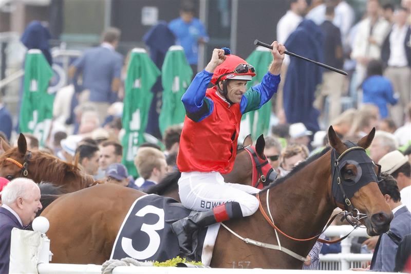 SYDNEY, AUSTRALIA - OCTOBER 22: Hugh Bowman raises his arms in the air after winning race 8 the Moet & Chandon Spring Champion Stakes on Sharp 