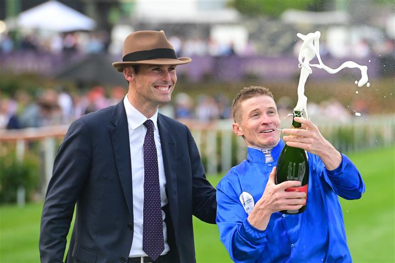 MELBOURNE, AUSTRALIA - OCTOBER 22: James McDonald and Trainer James Cummings celebrate after Anamoe won Race 9, the Ladbrokes Cox Plate,  during Cox Plate Day at Moonee Valley Racecourse on October 22, 2022 in Melbourne, Australia. (Photo by Vince Caligiuri/Getty Images)