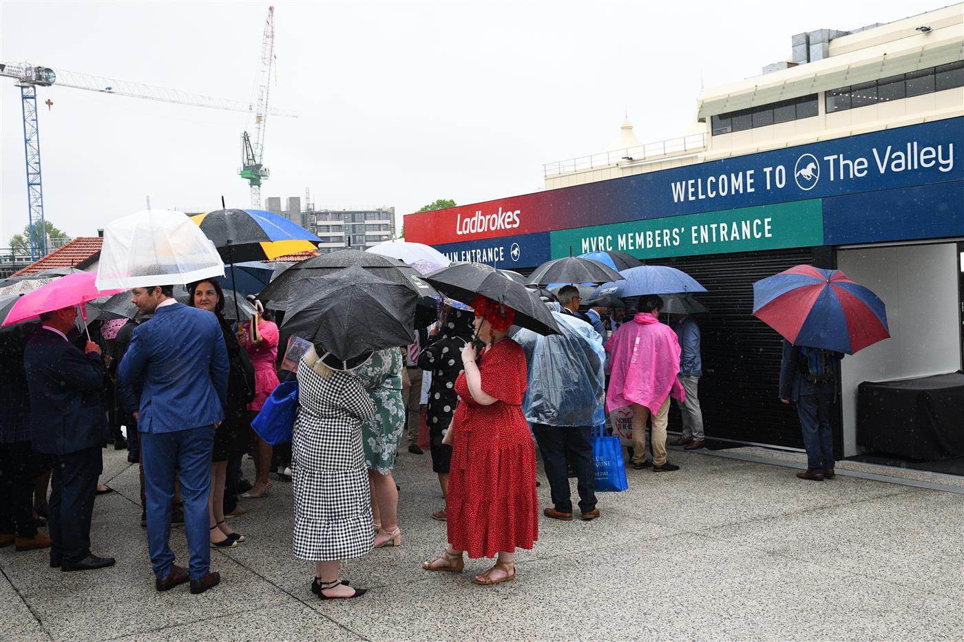 MELBOURNE, AUSTRALIA - OCTOBER 22: General view of racegoers lining up during Cox Plate Day at Moonee Valley Racecourse on October 22, 2022 in Melbourne, Australia. (Photo by Vince Caligiuri/Getty Images)
