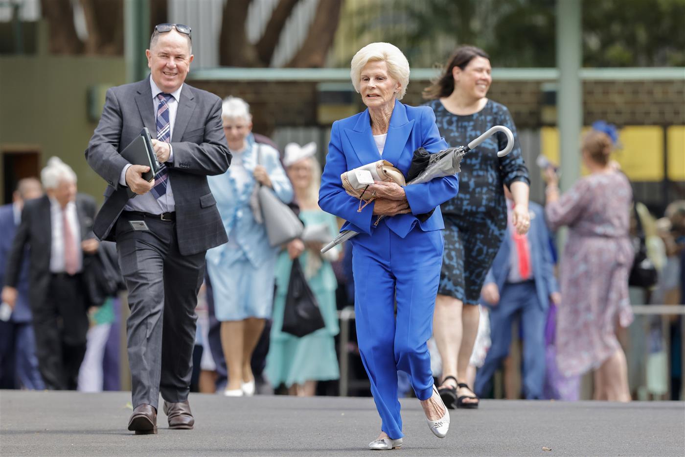SYDNEY, AUSTRALIA - OCTOBER 22: Racegoers run to get the best spots as the gates open ahead of Spring Champions Stakes Day at Royal Randwick Racecourse on October 22, 2022 in Sydney, Australia. (Photo by Jenny Evans/Getty Images)