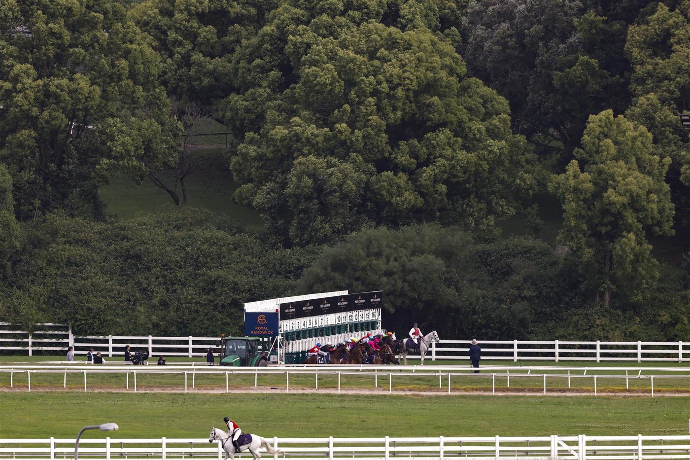 SYDNEY, AUSTRALIA - OCTOBER 22: Horses and jockeys jump from the barriers for race 9 The Invitation during Spring Champions Stakes Day at Royal Randwick Racecourse on October 22, 2022 in Sydney, Australia. (Photo by Jenny Evans/Getty Images)