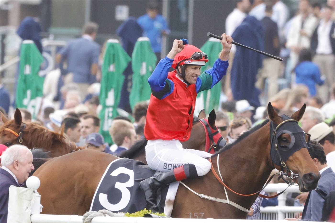 SYDNEY, AUSTRALIA - OCTOBER 22: Hugh Bowman raises his arms in the air after winning race 8 the Moet & Chandon Spring Champion Stakes on Sharp 