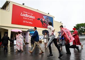 MELBOURNE, AUSTRALIA - OCTOBER 22: Racegoers arrive to attend the Cox Plate Day at Moonee Valley Racecourse on October 22, 2022 in Melbourne, Australia. (Photo by Vince Caligiuri/Getty Images)