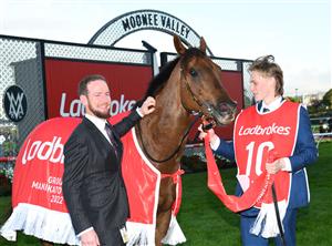 MELBOURNE, AUSTRALIA - OCTOBER 22: Ciaron Maher poses with Bella Nipotina after winning race 11, the Ladbrokes Manikato Stakes during Cox Plate Day at Moonee Valley Racecourse on October 22, 2022 in Melbourne, Australia. (Photo by Vince Caligiuri/Getty Images)