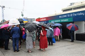 MELBOURNE, AUSTRALIA - OCTOBER 22: General view of racegoers lining up during Cox Plate Day at Moonee Valley Racecourse on October 22, 2022 in Melbourne, Australia. (Photo by Vince Caligiuri/Getty Images)