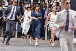 SYDNEY, AUSTRALIA - OCTOBER 22: Racegoers run to get the best spots as the gates open ahead of Spring Champions Stakes Day at Royal Randwick Racecourse on October 22, 2022 in Sydney, Australia. (Photo by Jenny Evans/Getty Images)