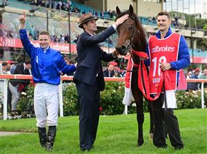MELBOURNE, AUSTRALIA - OCTOBER 22: James McDonald and Trainer James Cummings celebrate after Anamoe won Race 9, the Ladbrokes Cox Plate, during Cox Plate Day at Moonee Valley Racecourse on October 22, 2022 in Melbourne, Australia. (Photo by Vince Caligiuri/Getty Images)