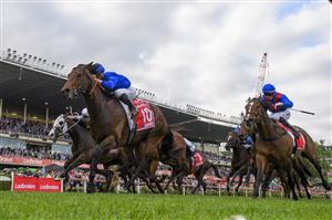 MELBOURNE, AUSTRALIA - OCTOBER 22: James McDonald riding Anamoe defeating Mark Zahra riding I