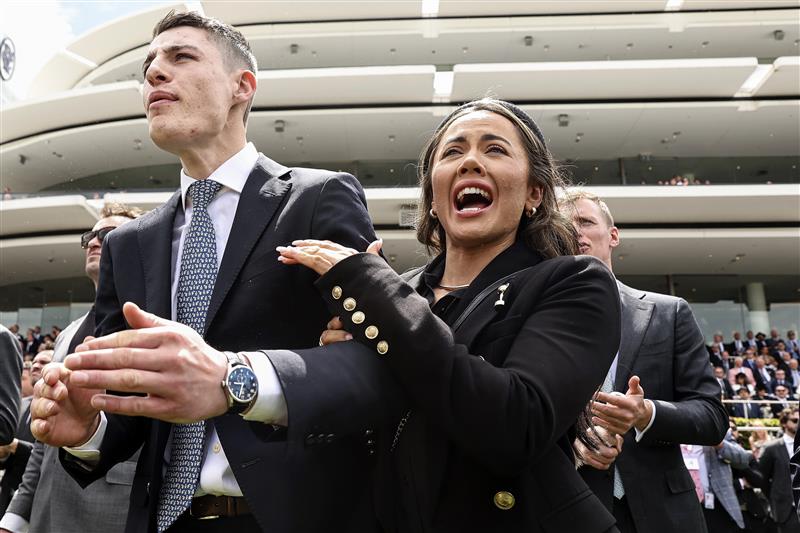MELBOURNE, AUSTRALIA - OCTOBER 26: Racing fans react while watching Race 3, the Paramount+ Rising Fast Stakes from the Members Lawn during 2022 Penfolds Victoria Derby Day at Flemington Racecourse on October 29, 2022 in Melbourne, Australia. (Photo by Martin Keep/Getty Images for VRC)