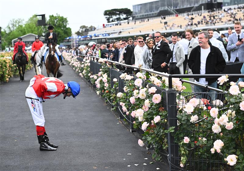 MELBOURNE, AUSTRALIA - OCTOBER 29: Craig Williams bows to the crowd after riding Icebath to win  Race 8, the Tab Empire Rose Stakes, during 2022 Penfolds Victoria Derby Day at Flemington Racecourse on October 29, 2022 in Melbourne, Australia. (Photo by Vince Caligiuri/Getty Images)