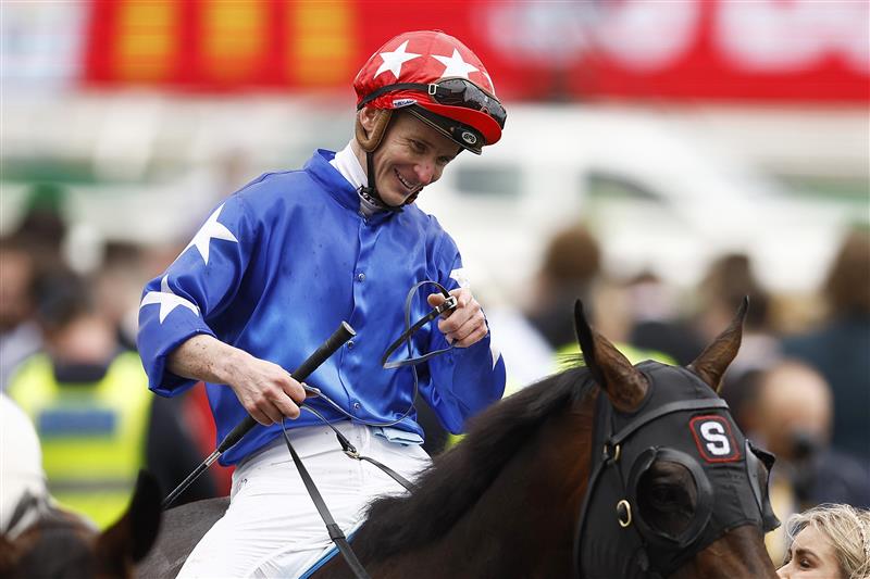 MELBOURNE, AUSTRALIA - OCTOBER 29: James McDonald rides Old Flame after winning race 5 the TAB Linlithgow Stakes during 2022 Penfolds Victoria Derby Day at Flemington Racecourse on October 29, 2022 in Melbourne, Australia. (Photo by Daniel Pockett/Getty Images)