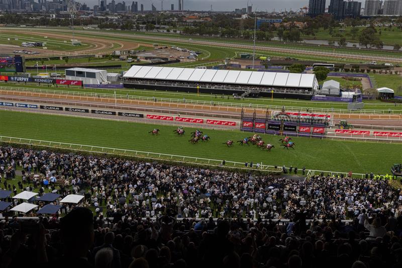 MELBOURNE, AUSTRALIA - OCTOBER 29: A general view as spectators watch Michael Dee riding horse Manzoice passing the finishing post to win the Penfolds Victoria Derby during 2022 Penfolds Victoria Derby Day at Flemington Racecourse on October 29, 2022 in Melbourne, Australia. (Photo by Asanka Ratnayake/Getty Images)