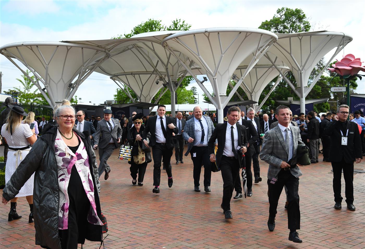 MELBOURNE, AUSTRALIA - OCTOBER 29: Racegoers arrive for the 2022 Penfolds Victoria Derby Day at Flemington Racecourse on October 29, 2022 in Melbourne, Australia. (Photo by Vince Caligiuri/Getty Images)