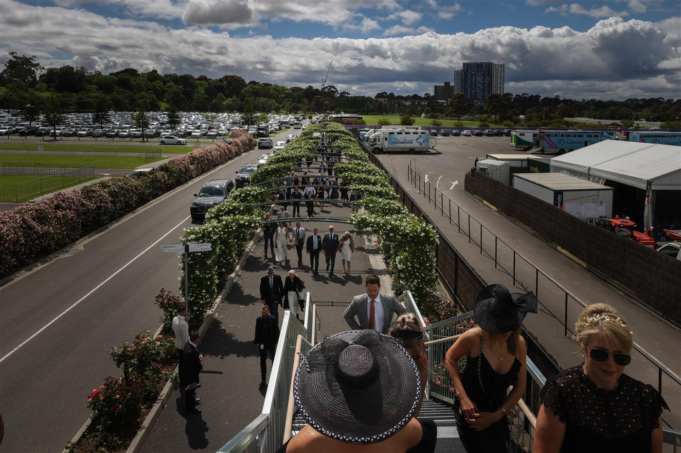 MELBOURNE, AUSTRALIA - OCTOBER 29: Racegoers arrive to Flemington Racecourse for the 2022 AAMI Victoria Derby Day at Flemington Racecourse on October 29, 2022 in Melbourne, Australia. (Photo by Asanka Ratnayake/Getty Images)