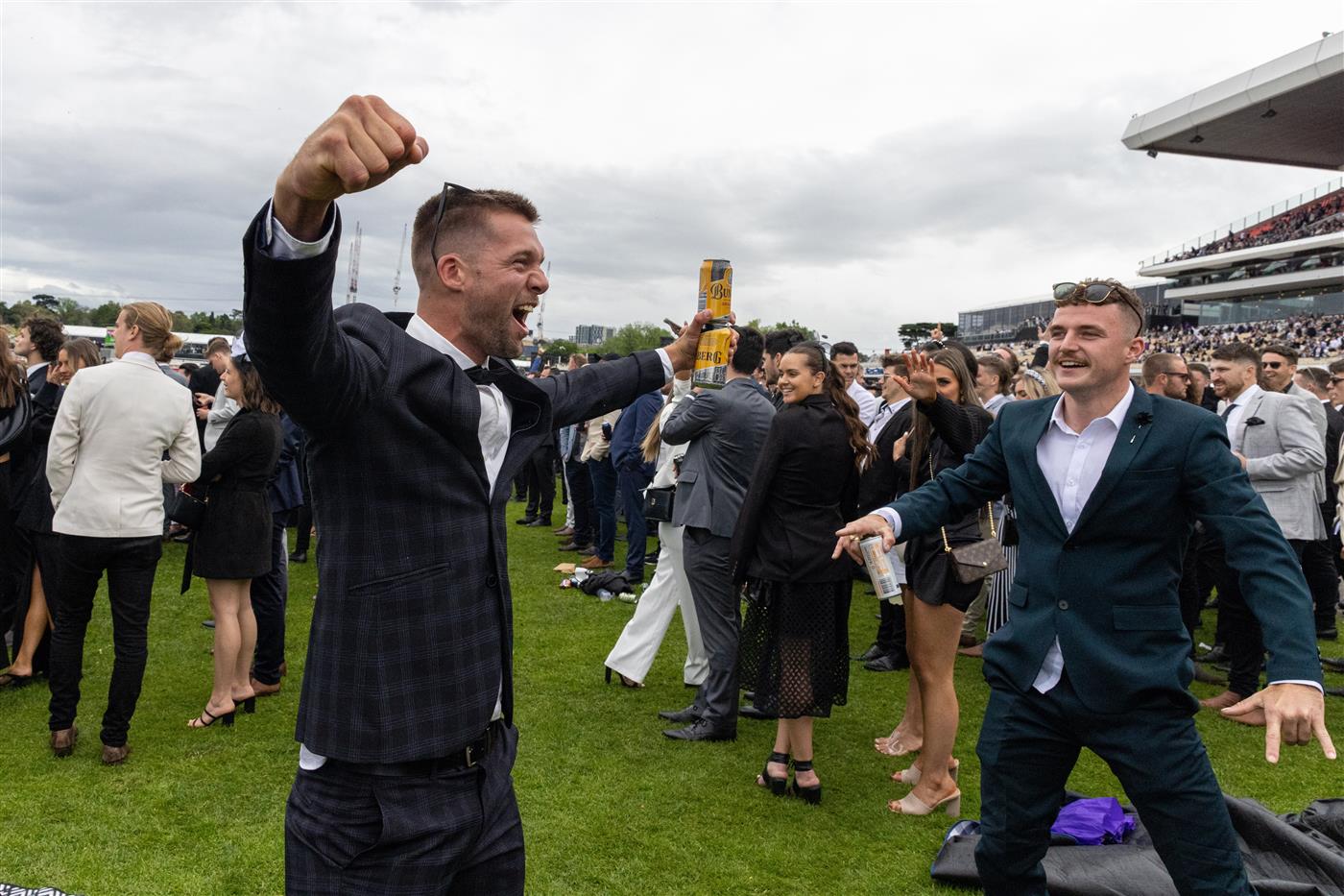 MELBOURNE, AUSTRALIA - OCTOBER 29: A racegoer celebrates at the conclusion of a race during 2022 Penfolds Victoria Derby Day at Flemington Racecourse on October 29, 2022 in Melbourne, Australia. (Photo by Asanka Ratnayake/Getty Images)