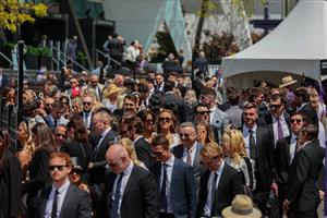 MELBOURNE, AUSTRALIA - OCTOBER 29: Racegoers arrive to  Flemington Racecourse for the 2022 AAMI Victoria Derby Day at Flemington Racecourse on October 29, 2022 in Melbourne, Australia. (Photo by Asanka Ratnayake/Getty Images)