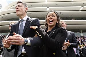 MELBOURNE, AUSTRALIA - OCTOBER 26: Racing fans react while watching Race 3, the Paramount+ Rising Fast Stakes from the Members Lawn during 2022 Penfolds Victoria Derby Day at Flemington Racecourse on October 29, 2022 in Melbourne, Australia. (Photo by Martin Keep/Getty Images for VRC)