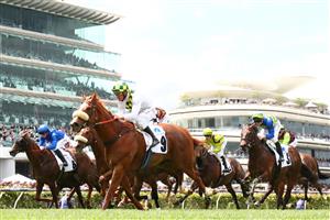 MELBOURNE, AUSTRALIA - OCTOBER 29: Damien Oliver riding #9 Argentia wins race three the Paramount+ Rising Fast Stakes during 2022 Penfolds Victoria Derby Day at Flemington Racecourse on October 29, 2022 in Melbourne, Australia. (Photo by Robert Cianflone/Getty Images)