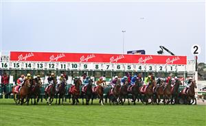 MELBOURNE, AUSTRALIA - OCTOBER 29: Michael Dee riding Manzoice jumps out of barrier eight at the start before winning Race 7, the Penfolds Victoria Derby, during 2022 Penfolds Victoria Derby Day at Flemington Racecourse on October 29, 2022 in Melbourne, Australia. (Photo by Vince Caligiuri/Getty Images)
