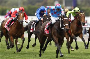 MELBOURNE, AUSTRALIA - OCTOBER 29: Michael Dee riding Manzoice #7 wins race seven the Penfolds Victoria Derby during 2022 Penfolds Victoria Derby Day at Flemington Racecourse on October 29, 2022 in Melbourne, Australia. (Photo by Daniel Pockett/Getty Images)