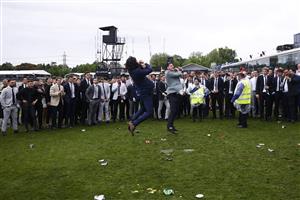 MELBOURNE, AUSTRALIA - OCTOBER 29: Police and security attempt to break up a large crowd of racegoers for unsocial behaviour after the final race during 2022 Penfolds Victoria Derby Day at Flemington Racecourse on October 29, 2022 in Melbourne, Australia. (Photo by Daniel Pockett/Getty Images)