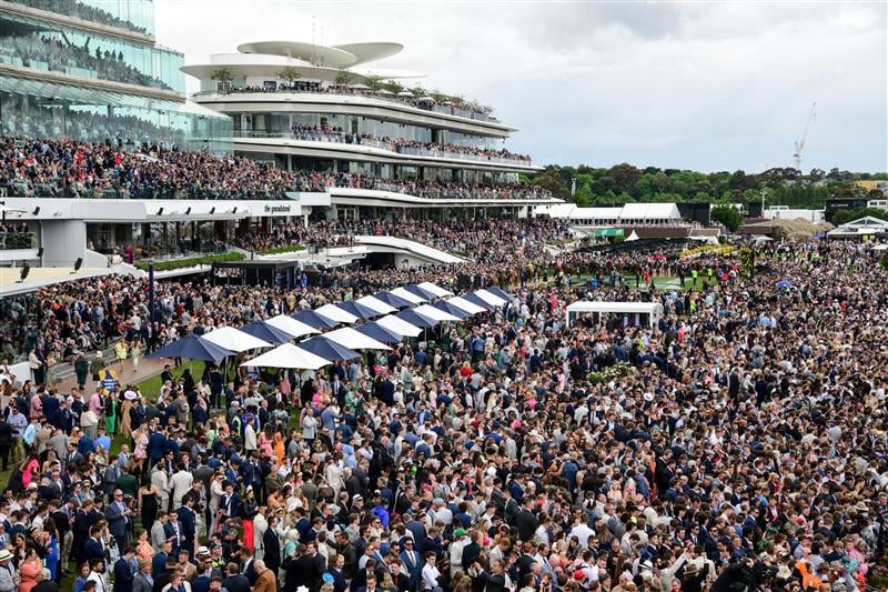 MELBOURNE, AUSTRALIA - NOVEMBER 01: General view of crowd as horses walk onto the track before Race 7, the Lexus Melbourne Cup, during 2022 Lexus Melbourne Cup Day at Flemington Racecourse on November 01, 2022 in Melbourne, Australia. (Photo by Vince Caligiuri/Getty Images)