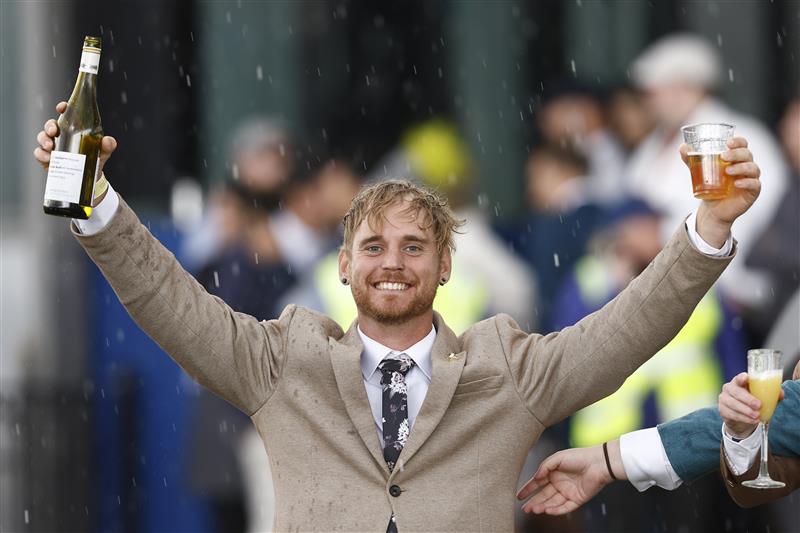 MELBOURNE, AUSTRALIA - NOVEMBER 01: A race fan is seen during 2022 Melbourne Cup Day at Flemington Racecourse on November 01, 2022 in Melbourne, Australia. (Photo by Darrian Traynor/Getty Images)