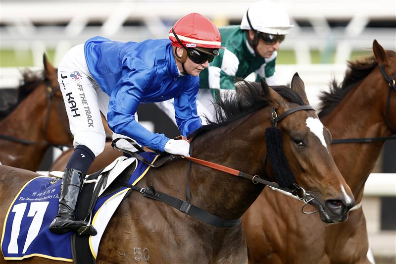 MELBOURNE, AUSTRALIA - NOVEMBER 01: Jamie Kah rides Larkspur Run to win race 9 the Hong Kong Jockey Club Stakes  during 2022 Melbourne Cup Day at Flemington Racecourse on November 01, 2022 in Melbourne, Australia. (Photo by Darrian Traynor/Getty Images)