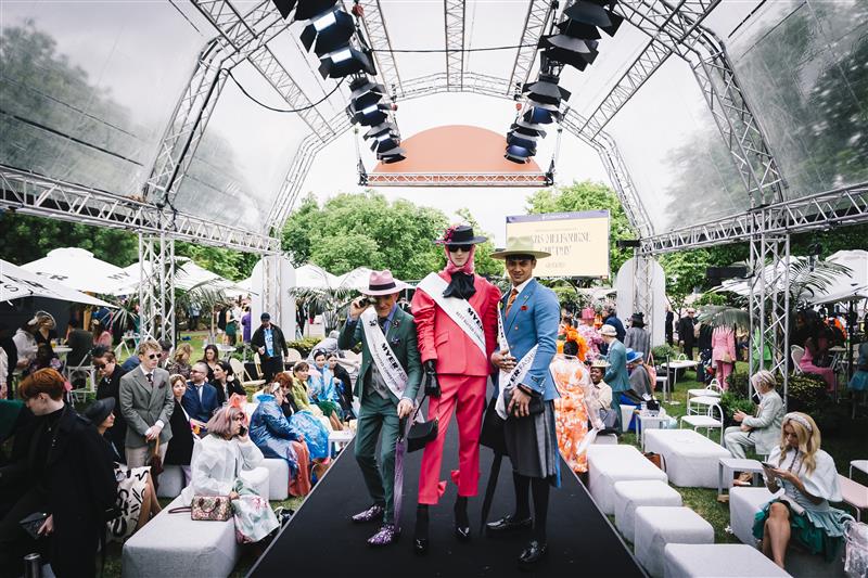MELBOURNE, AUSTRALIA - NOVEMBER 01: Fashions on The Field Best Suited finalists Michael McAlpine, Joel Parkinson, Sherlon Garbo during 2022 Melbourne Cup Day at Flemington Racecourse on November 01, 2022 in Melbourne, Australia. (Photo by Naomi Rahim/Getty Images for VRC)