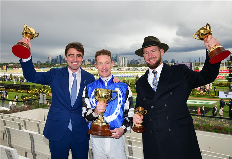 MELBOURNE, AUSTRALIA - NOVEMBER 01: Trainers David Eustace, Ciaron Maher and jockey Mark Zahra pose with the Melbourne Cup after Gold Trip won Race 7, the Lexus Melbourne Cup, during 2022 Lexus Melbourne Cup Day at Flemington Racecourse on November 01, 2022 in Melbourne, Australia. (Photo by Vince Caligiuri/Getty Images)