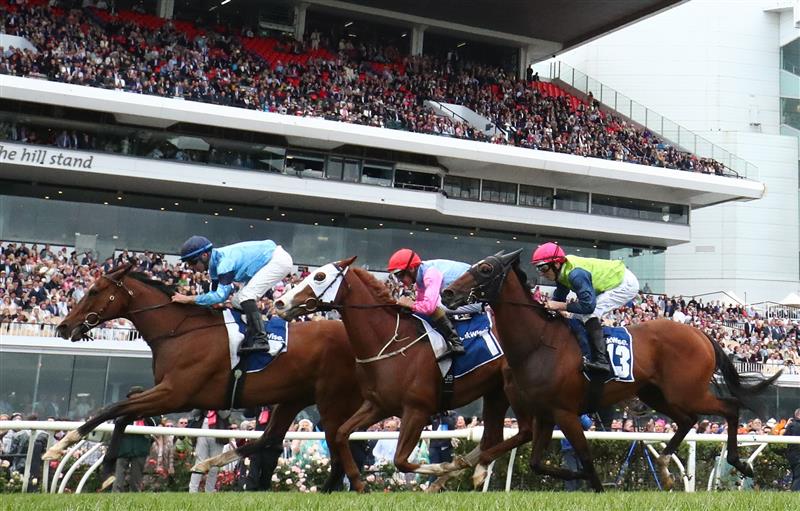 MELBOURNE, AUSTRALIA - NOVEMBER 01: Tommy Berry rides #5 Bartholomeu Dias to win race six the Furphy Plate during 2022 Lexus Melbourne Cup Day at Flemington Racecourse on November 01, 2022 in Melbourne, Australia. (Photo by Robert Cianflone/Getty Images)