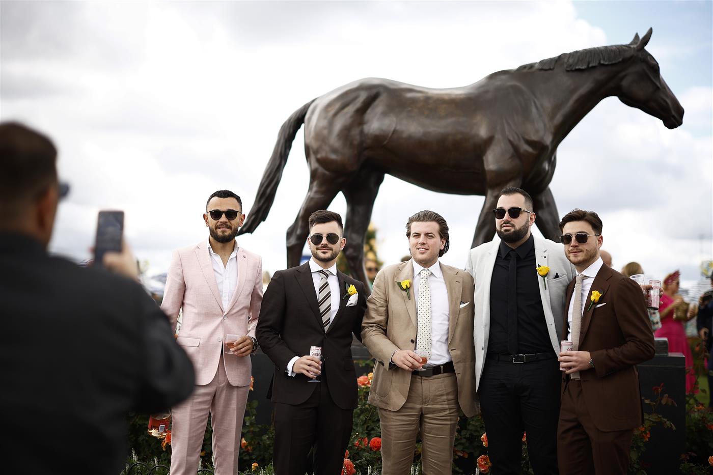 MELBOURNE, AUSTRALIA - NOVEMBER 01: Racegoers pose for a photograph during 2022 Lexus Melbourne Cup Day at Flemington Racecourse on November 01, 2022 in Melbourne, Australia. (Photo by Daniel Pockett/Getty Images)