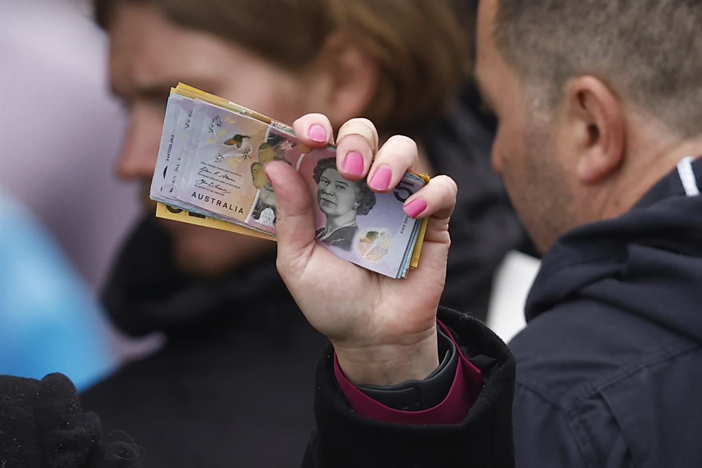 MELBOURNE, AUSTRALIA - NOVEMBER 01: Book makers take bets during 2022 Melbourne Cup Day at Flemington Racecourse on November 01, 2022 in Melbourne, Australia. (Photo by Darrian Traynor/Getty Images)