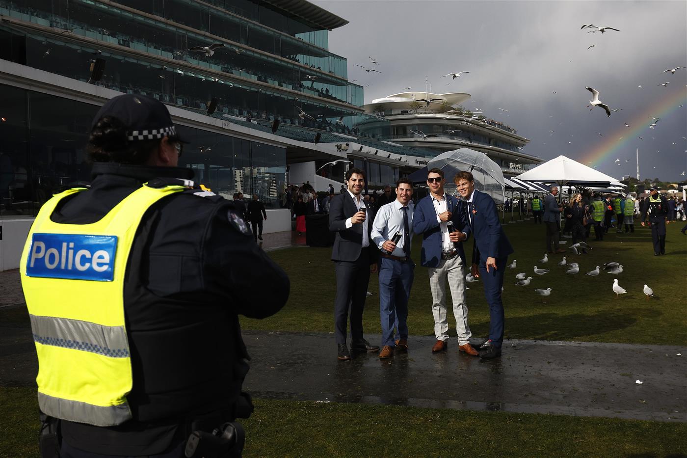 MELBOURNE, AUSTRALIA - NOVEMBER 01: Racegoers pose for a photograph during 2022 Lexus Melbourne Cup Day at Flemington Racecourse on November 01, 2022 in Melbourne, Australia. (Photo by Daniel Pockett/Getty Images)
