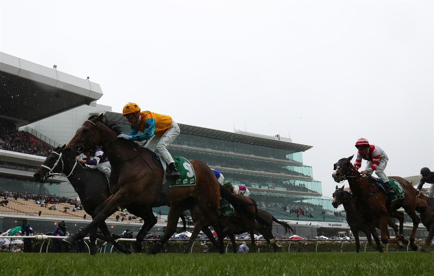 MELBOURNE, AUSTRALIA - NOVEMBER 01: Ben Melham rides #9 High Approach to win race four the Tab Trophy during 2022 Lexus Melbourne Cup Day at Flemington Racecourse on November 01, 2022 in Melbourne, Australia. (Photo by Robert Cianflone/Getty Images)
