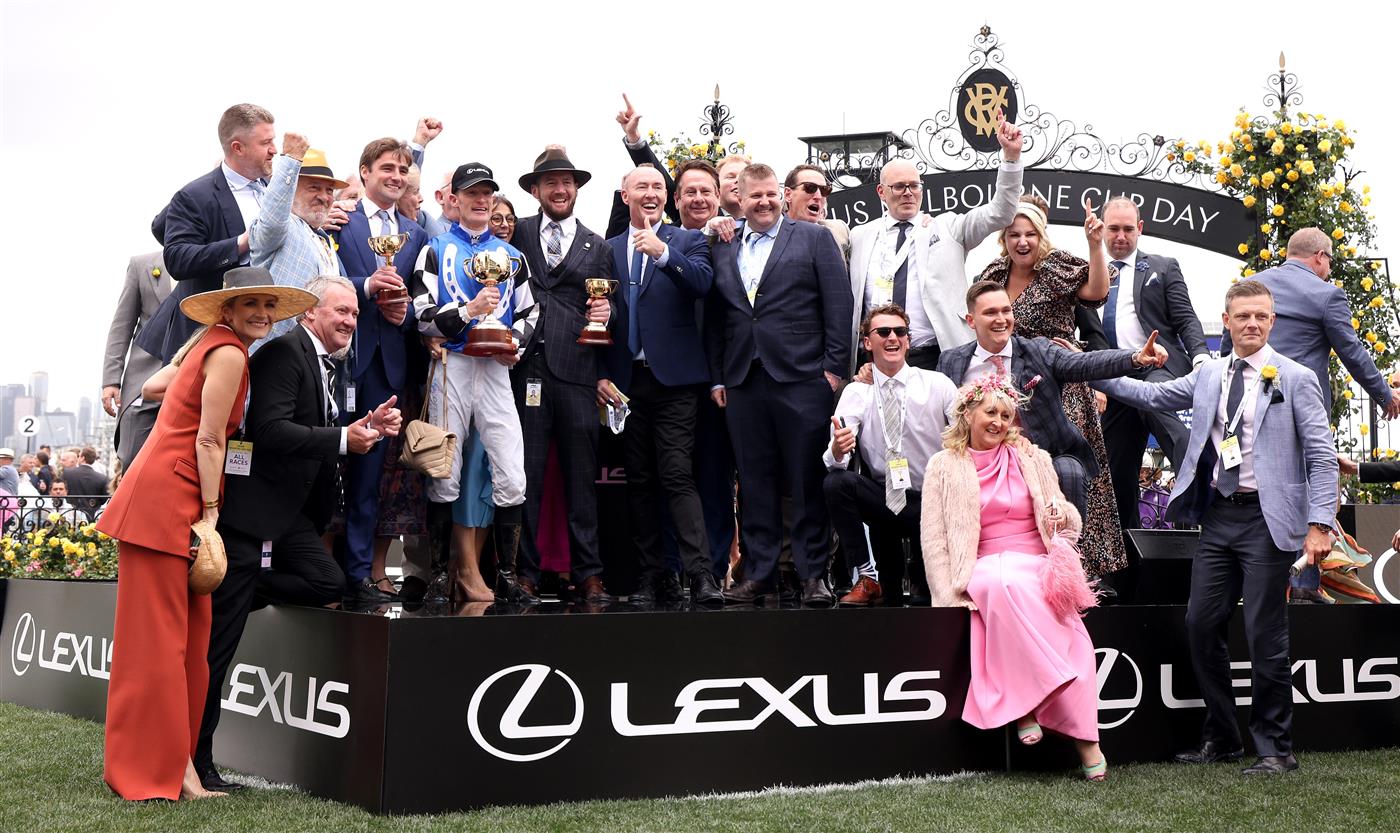 MELBOURNE, AUSTRALIA - NOVEMBER 01: The winning connections of Gold Trip pose with the Melbourne Cup after Gold Trip won Race 7, the Lexus Melbourne Cup, during 2022 Melbourne Cup Day at Flemington Racecourse on November 01, 2022 in Melbourne, Australia. (Photo by Jonathan DiMaggio/Getty Images for VRC)