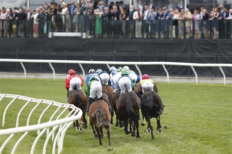 MELBOURNE, AUSTRALIA - NOVEMBER 03: The field passes the post for the first time in race 8 the Kennedy Oaks during 2022 Kennedy Oaks Day at Flemington Racecourse on November 03, 2022 in Melbourne, Australia. (Photo by Darrian Traynor/Getty Images)
