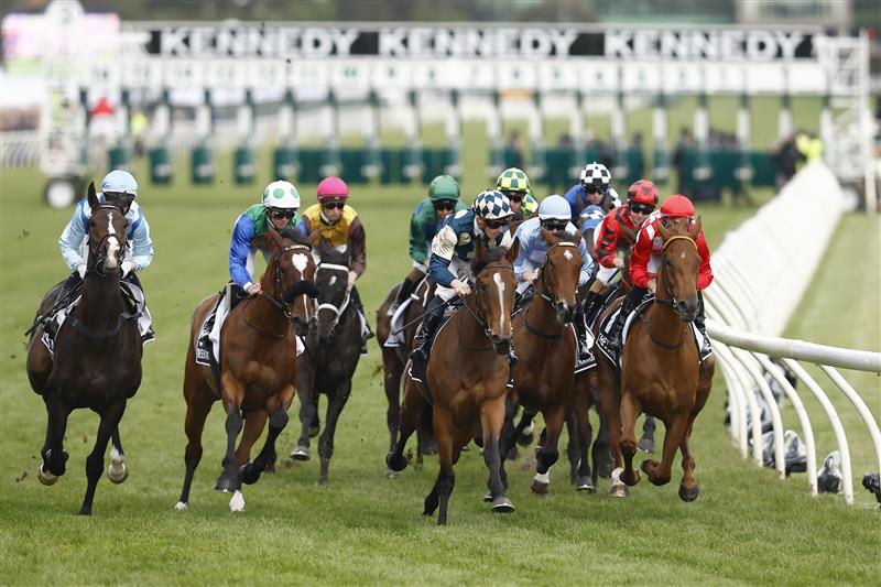MELBOURNE, AUSTRALIA - NOVEMBER 03: The field passes the post for the first time in race 8 the Kennedy Oaks during 2022 Kennedy Oaks Day at Flemington Racecourse on November 03, 2022 in Melbourne, Australia. (Photo by Darrian Traynor/Getty Images)