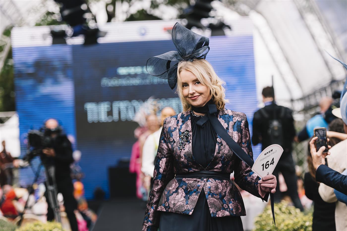 MELBOURNE, AUSTRALIA - NOVEMBER 03: Fashions on the Field contestants walk the runwayduring 2022 Oaks Day at Flemington Racecourse on November 03, 2022 in Melbourne, Australia. (Photo by Naomi Rahim/Getty Images for VRC)