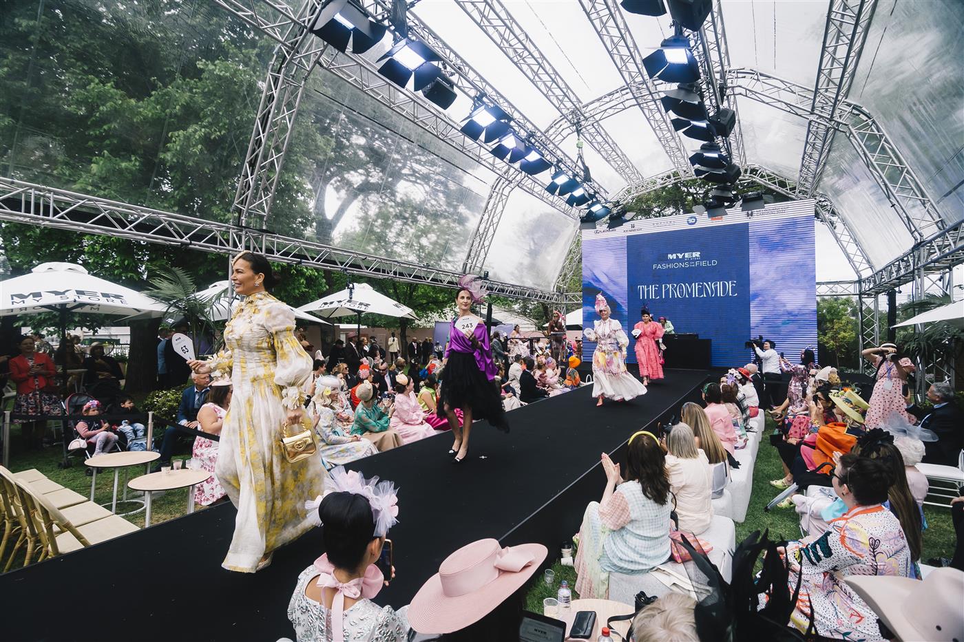 MELBOURNE, AUSTRALIA - NOVEMBER 03: Fashions on the Field contestants walk the Best Dressed runway during 2022 Oaks Day at Flemington Racecourse on November 03, 2022 in Melbourne, Australia. (Photo by Naomi Rahim/Getty Images for VRC)