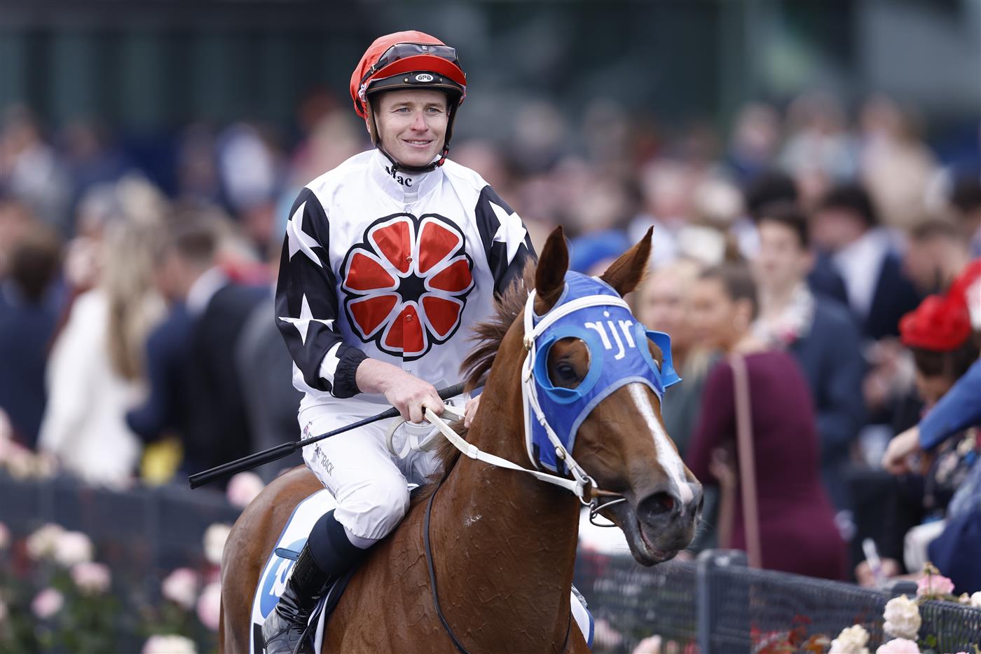 MELBOURNE, AUSTRALIA - NOVEMBER 03: Jamie McDonald returns to scale on Aitch Two Oh after winnin race 9 the Network 10 News Red Roses Stakes during 2022 Kennedy Oaks Day at Flemington Racecourse on November 03, 2022 in Melbourne, Australia. (Photo by Darrian Traynor/Getty Images)