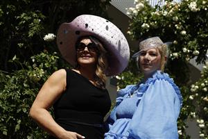 MELBOURNE, AUSTRALIA - NOVEMBER 03: Race fans arrive before 2022 Kennedy Oaks Day at Flemington Racecourse on November 03, 2022 in Melbourne, Australia. (Photo by Darrian Traynor/Getty Images)