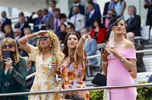 MELBOURNE, AUSTRALIA - NOVEMBER 03: Racegoers look on during 2022 Oaks Day at Flemington Racecourse on November 03, 2022 in Melbourne, Australia. (Photo by Luke Hemer/Getty Images for VRC)