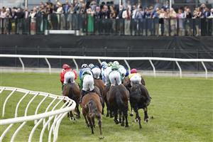 MELBOURNE, AUSTRALIA - NOVEMBER 03: The field passes the post for the first time in race 8 the Kennedy Oaks during 2022 Kennedy Oaks Day at Flemington Racecourse on November 03, 2022 in Melbourne, Australia. (Photo by Darrian Traynor/Getty Images)