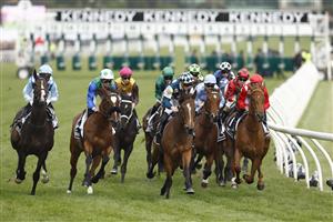 MELBOURNE, AUSTRALIA - NOVEMBER 03: The field passes the post for the first time in race 8 the Kennedy Oaks during 2022 Kennedy Oaks Day at Flemington Racecourse on November 03, 2022 in Melbourne, Australia. (Photo by Darrian Traynor/Getty Images)